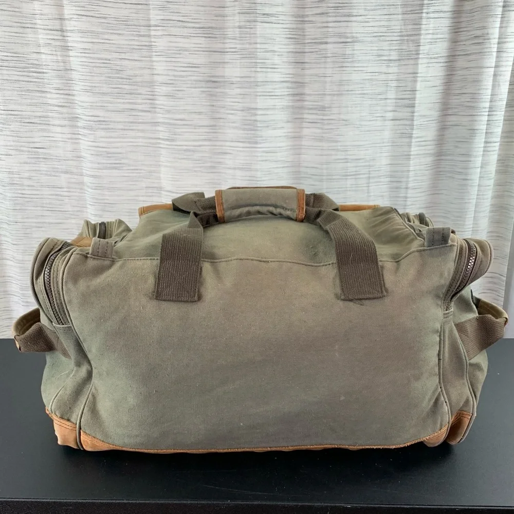 High Sierra Green canvas and Brown leather Duffel Bag.